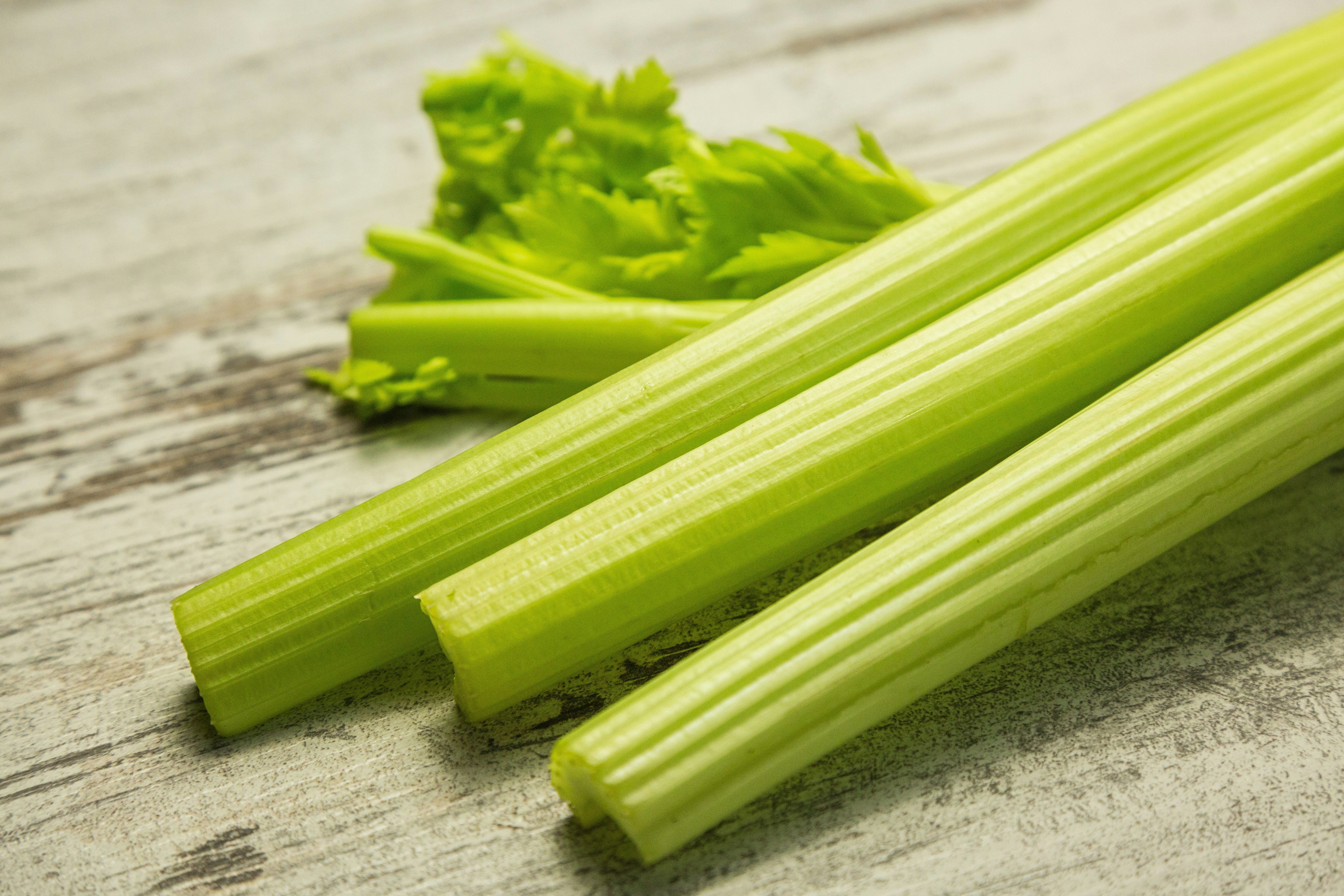 Chopped celery stalks on a cutting board